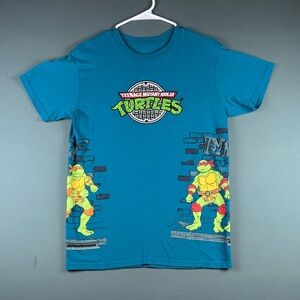 Teenage Mutant Ninja Turtles embroidered Graphic “Straight from the Sewer”.
